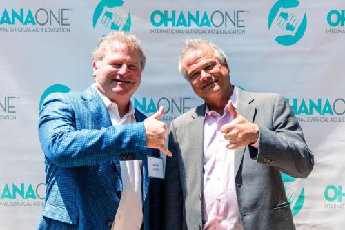 Brian Larky and Robert Uhlaner Holding Up Ohana One Shakas
