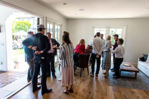 Fundraiser Guests Gather in a Living Room